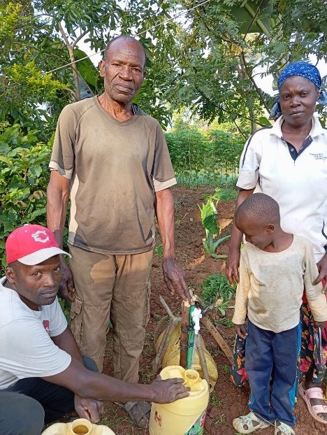Community member filling a jerry can at a Shiraha water point